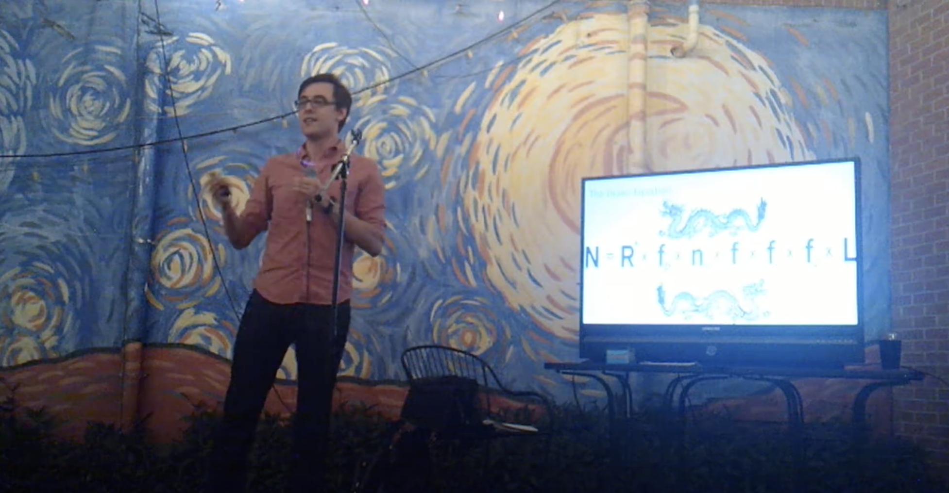 An image of Jonathan presenting an Astronomy on Tap talk in 2018.